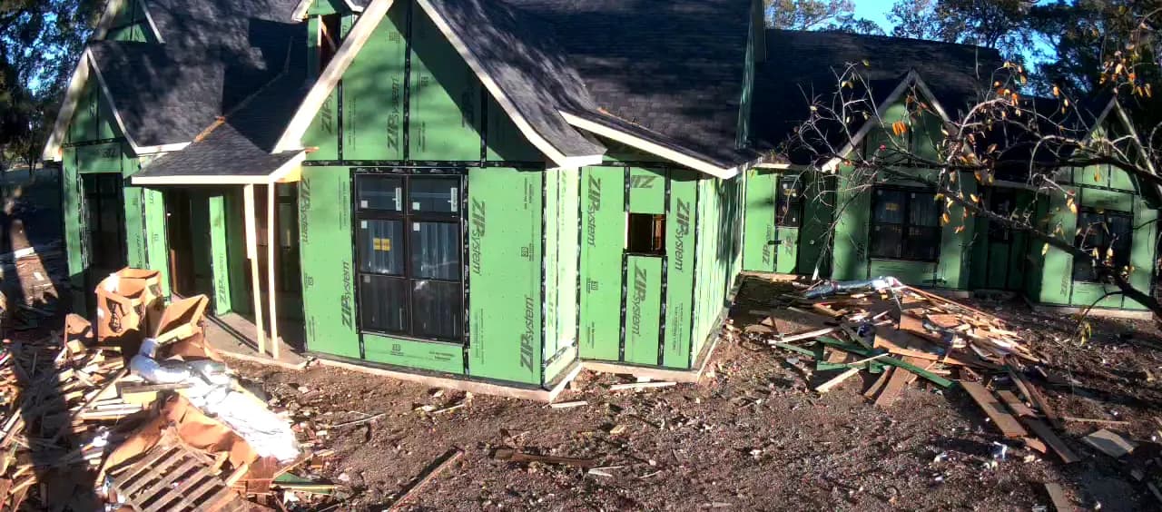 Windows set into the sheathed front elevation.